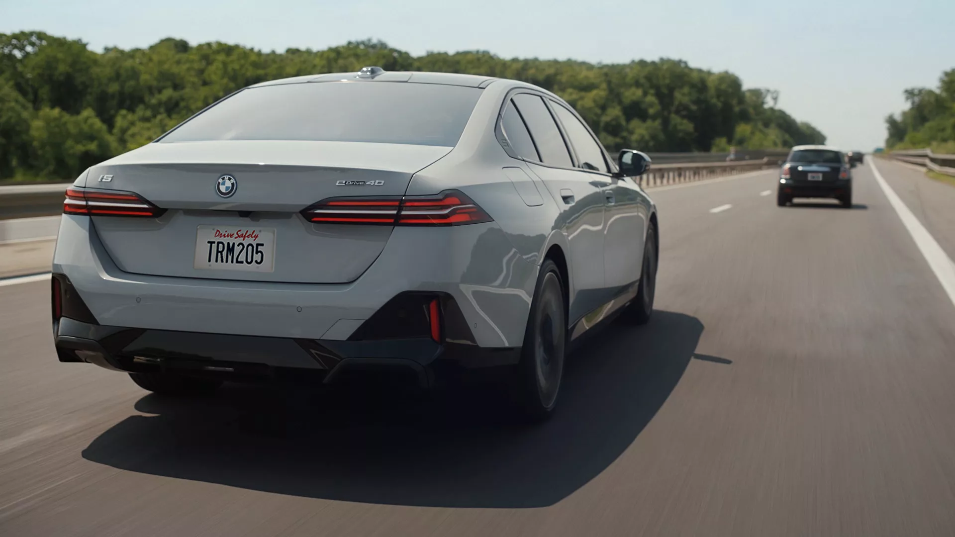 Exterior A Shot From Behind Of A Bmw I5 Edrive40 Driving Down The Highway