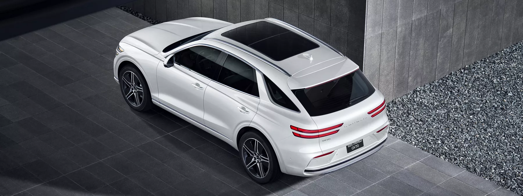 Exterior Aerial Rear Driver Side 3 4 View Of Genesis Electrified Gv70 In