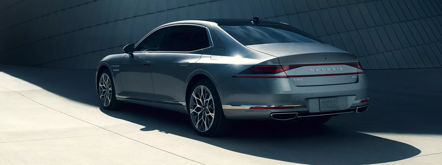 Exterior 7 8 Rear Driver Side View Of 2026 Genesis G90 In Savile Silver I