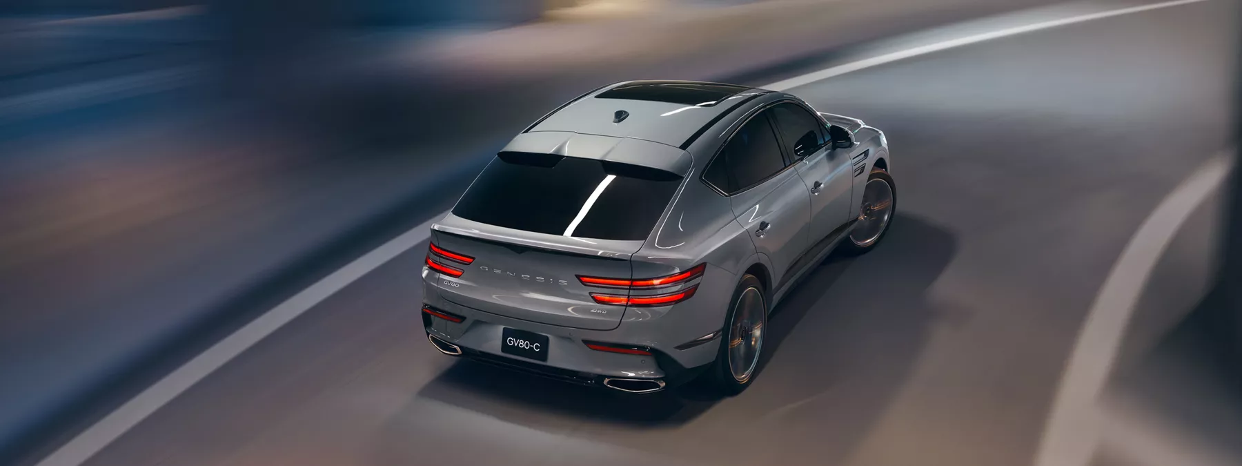 Exterior Rear Overhead View Of Genesis Gv80 Coupe In Bering Blue Driving