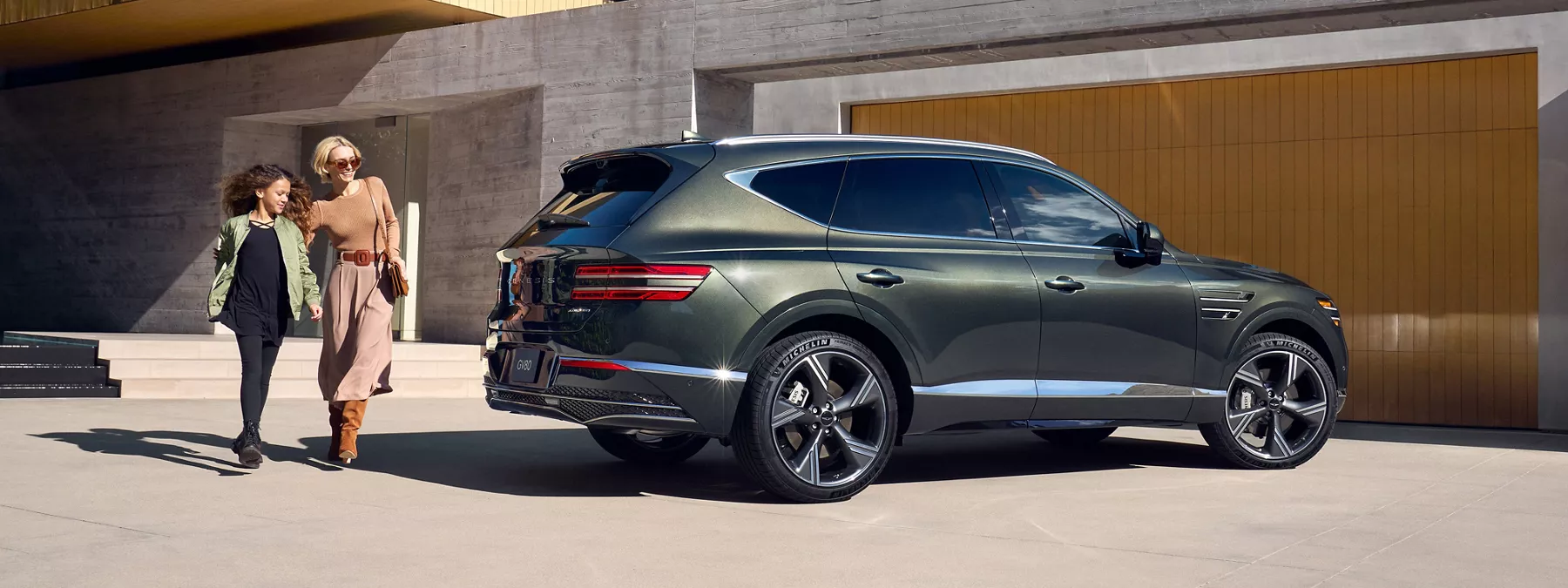 Exterior Front Passenger Side View Of Genesis Gv80 In Storr Green Parked