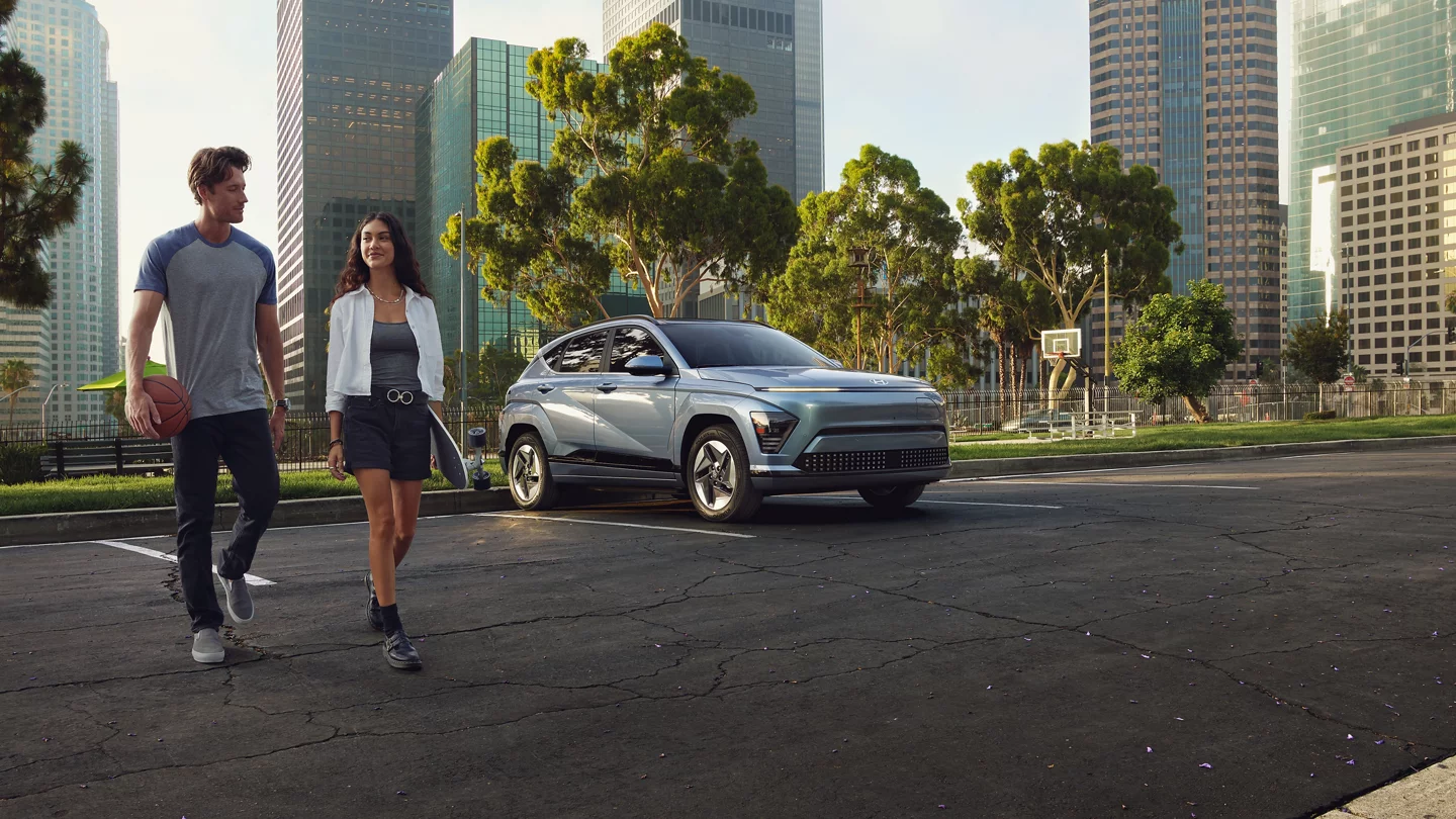 Exterior A Couple Walks Away From A 2025 Kona Electric