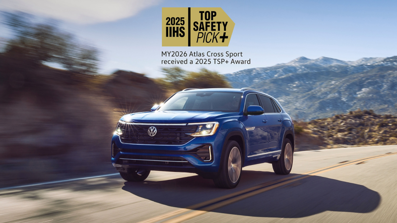 Exterior A Front View Of An Atlas Cross Sport Shown In Mountain Lake Blue Driving